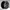 Black alloy wheel on a gray background
