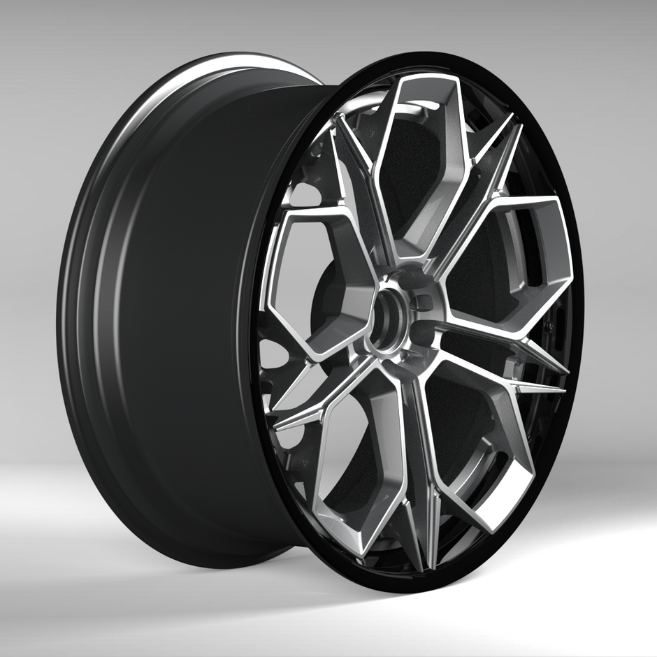 Black alloy wheel on a gray background