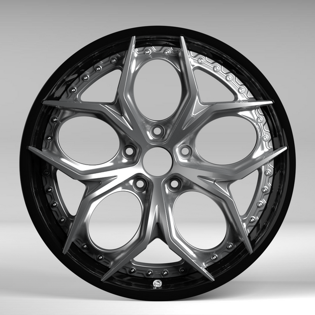 Car wheel rim with a metallic finish on a gray background