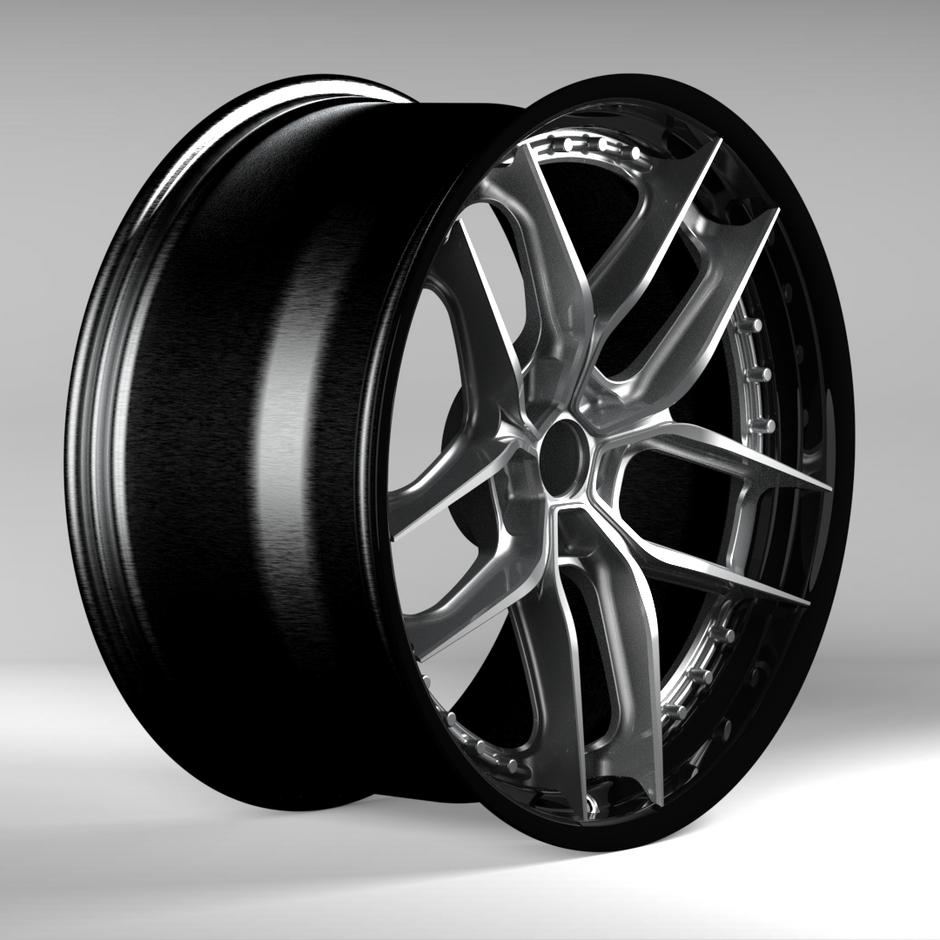 Black alloy wheel on a gray background