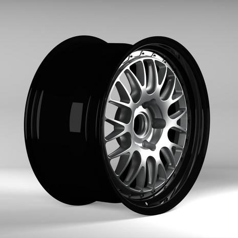 Black alloy wheel on a gray background